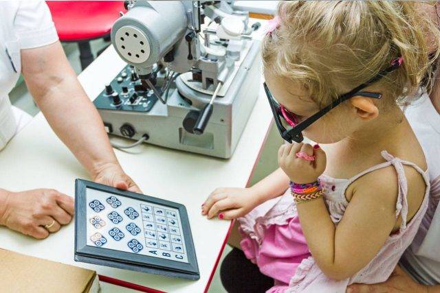 Little girl having eye exam in Wilmington